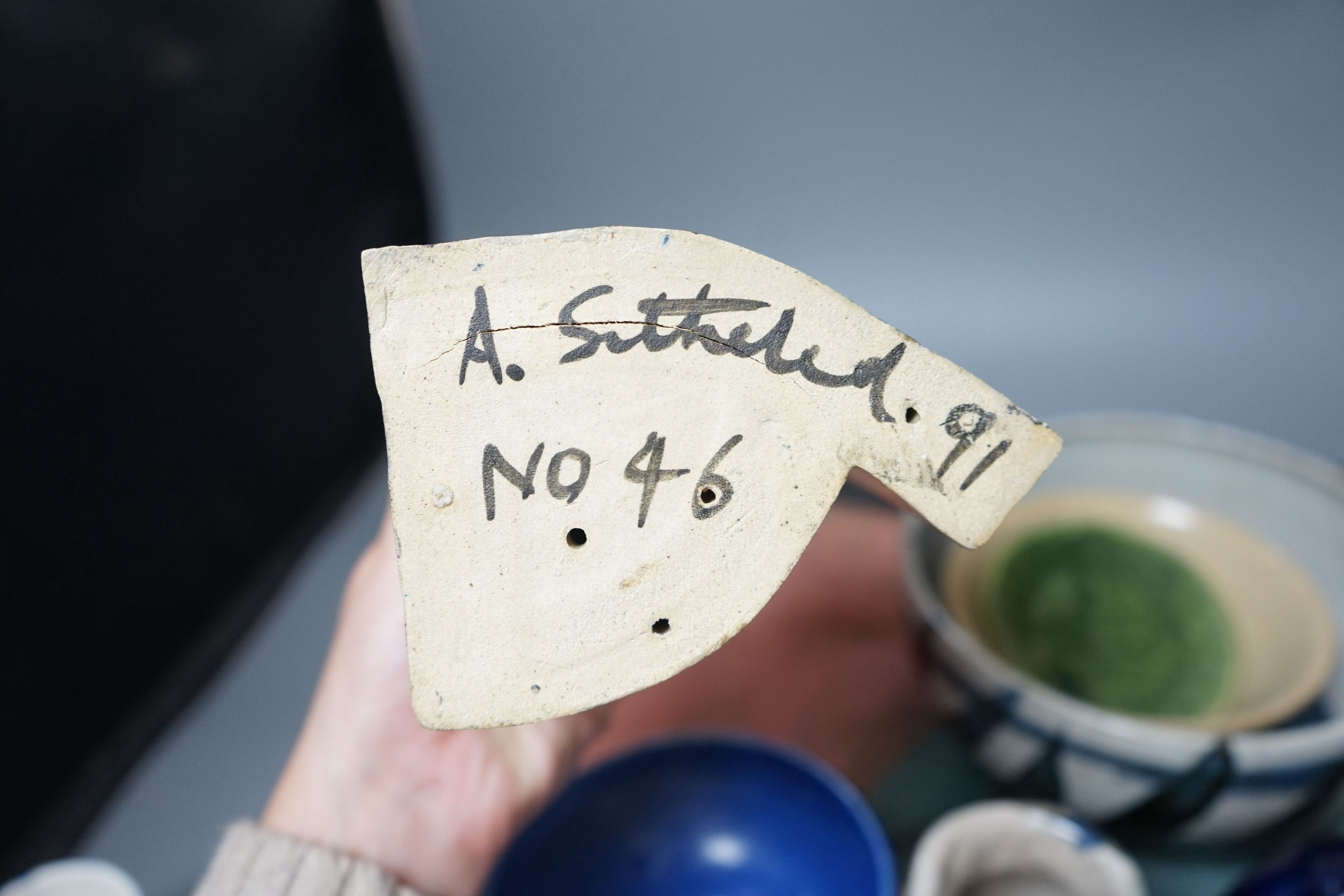 Studio pottery; a large square polychrome platter signed ‘Eastman June 87’ and a geometric vase indistinctly signed and dated 91, together with other various studio pottery wares
